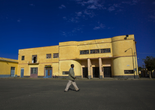 Man Passing In Front Of An Old Colonial Italian Cinema Theatre, Debub, Dekemhare, Eritrea