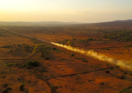 Aerial view of of a truck in a an arid area making a lot of dust, Oromia, Yabelo, Ethiopia