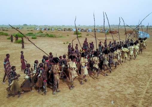 Aerial view of dimi ceremony in the Dassanech tribe to celebrate circumcision of teenagers, Omo Valley, Omorate, Ethiopia