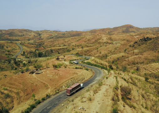 Aerial view of a truck passing in the Konso hills and terraces, Omo Valley, Konso, Ethiopia