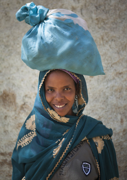 Portrait Of A Smiling Woman With A Bag On Her Head, Ethiopia