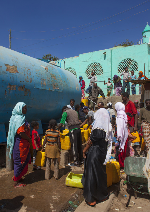 Women Fulling Up Cans From A Water Tanker, Harar, Ethiopia