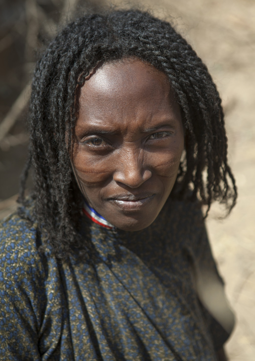 Karrayyu Tribe Mature Woman With Stranded Hair And Scars On Her Cheeks, Metehara, Ethiopia