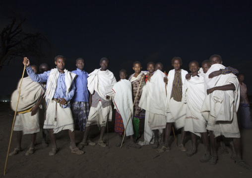 Night Shot Of A Group Of Karrayyu Tribe Men Standing Proud During Gadaaa Ceremony, Metahara, Ethiopia