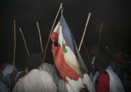 Rear View Of A Group Of Karrayyu Tribe Men Attending Stick Fighting With Oromo Flag During Gadaaa Ceremony, Metahara, Ethiopia