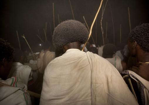 Night Shot, Rear View Of Karrayyu Tribe Men With Traditional Gunfura Hairstyle Attending Stick Fighting During Gadaaa Ceremony, Metahara, Ethiopia
