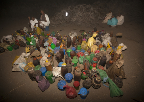 Night Shot Of Karrayyu Tribe People Waiting Near The Food Brought For The Gadaaa Ceremony, Metahara, Ethiopia