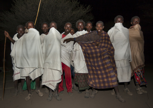 Night Shot Of A Group Of Smiling Karrayyu Tribe Teenage Boys During Gadaaa Ceremony, Metahara, Ethiopia