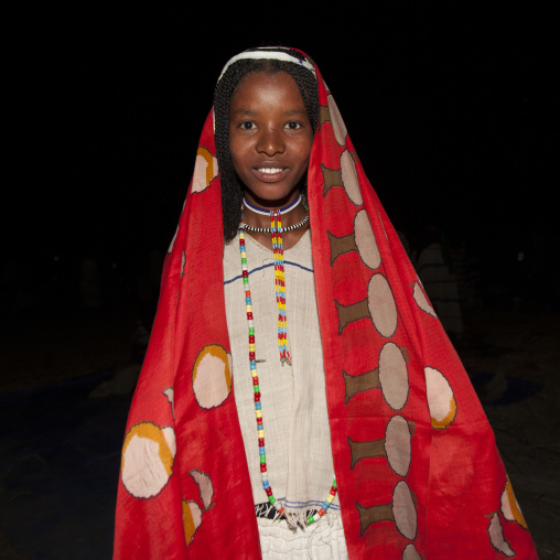 Night Shot, Portrait Of A Karrayyu Tribe Girl With Bright Red Head Scarf And Colourful Necklaces During Gadaaa Ceremony, Metahara, Ethiopia