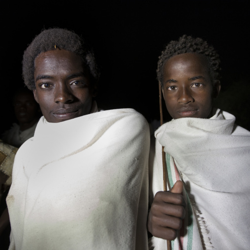 Night Shot Of Two Smiling Karrayyu Tribe Teenage Boys During Gadaaa Ceremony, Metahara, Ethiopia