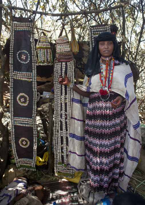 Karrayyu Tribe Woman Standing In The House Built For The Gadaaa Ceremony Decorated With Pieaces Of Leather Incrusted With Shells, Metehara, Ethiopia