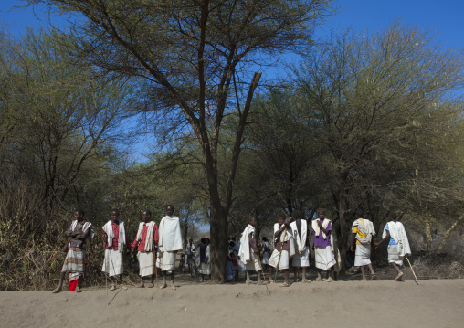 Group Of Young Karrayyu Tribe Men In Traditional Clothes At The Entrance Of A Forest During Gadaaa Ceremony, Metahara, Ethiopia