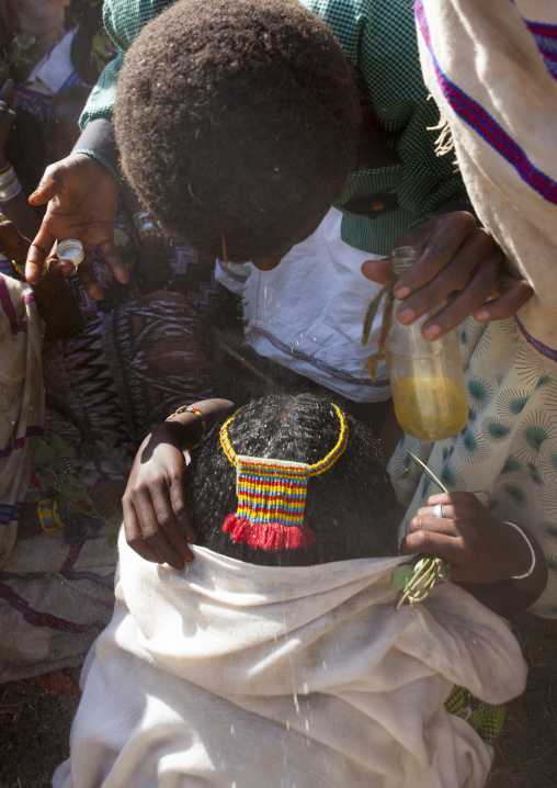 Karrayyu Tribe Man Spitting On His Sister In Order To Bless Her During Gadaaa Ceremony, Metahara, Ethiopia