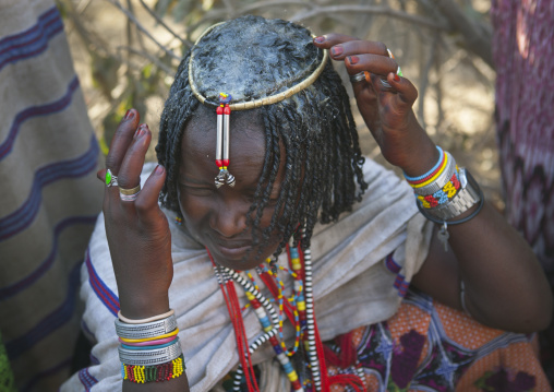 Young Karrayyu Tribe Girl Making A Shampoo With Butter At Gadaaa Ceremony, Metehara, Ethiopia