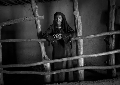 Black and white portrait of a girl inside her tukul in alaba, Ethiopia