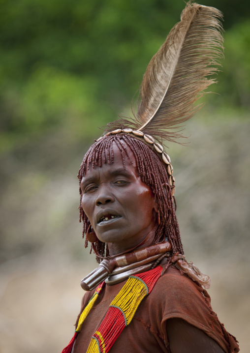 Hamer Tribe Woman With Feather And Iron Necklaces Celebrating Bull Jumping Ceremony, Omo Valley, Ethiopia
