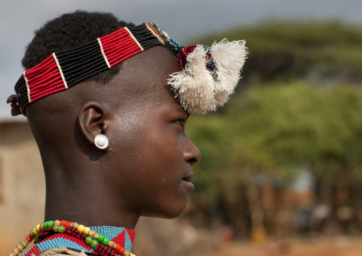 Ari teenage boy profile with traditional ornaments omo valley Ethiopia