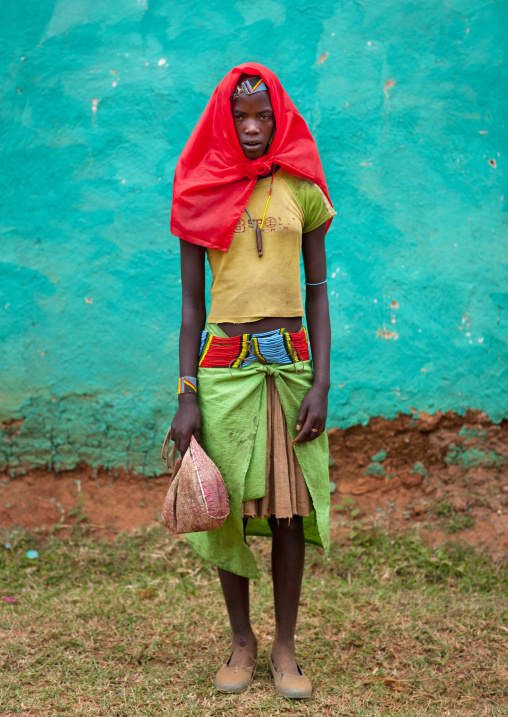 Standing Banna Teenage Girl With Whistle And Flushing Red Headscarf Omo Valley Ethiopia