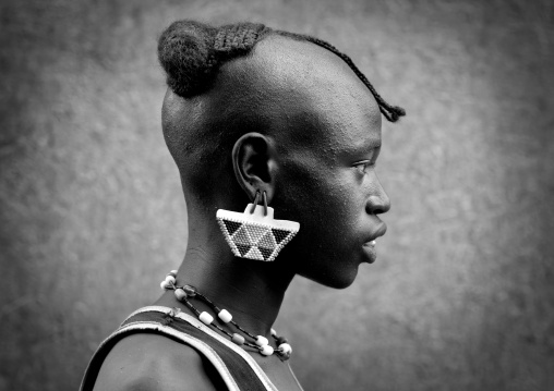 A tsemay tribe man and his impressive traditional hairstyle in key afer, Omo valley, Ethiopia