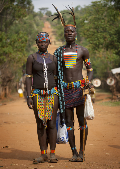 Banna Whipper Standing By A Traditional Garment Dressed Banna Young Woman At Key Afer Market Omo Valley Ethiopia