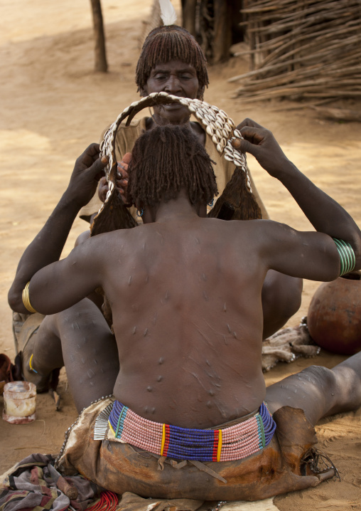 Scarified Back Banna Woman Getting Dressed For Ceremony Ethiopia
