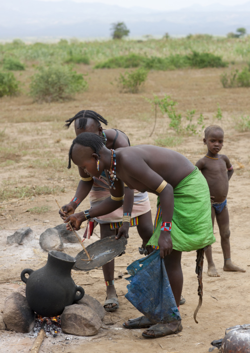 Banna Women With Original Hairstyle Cooking In Marmite On Campfire Ethiopia