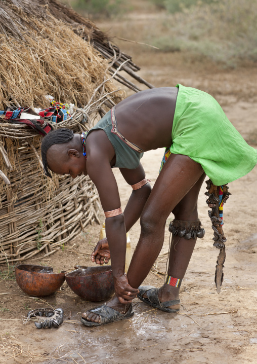 Bana Woman With Original Hairstyle Washing Her Feet Ethiopia