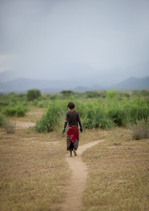Banna Woman Walking In The Nature Ethiopia