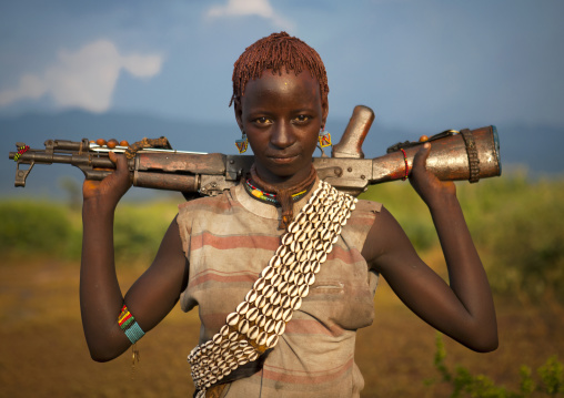 Bana Young Woman Carrying Kalashnikov Rifle On Her Shoulders Jumping Ceremony Ethiopia