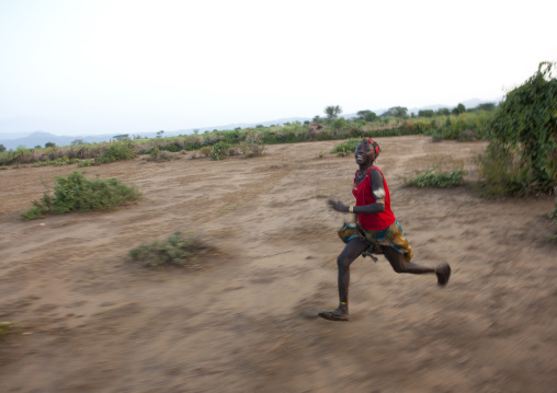 Young Banna Man Running In Nature Landscape Omo Valley Ethiopia