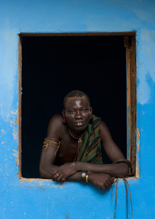 Bodi Man Looking At Camera In The Frame Of A Window Hana Mursi Village Hana Mursi Village Omo Valley Ethiopia