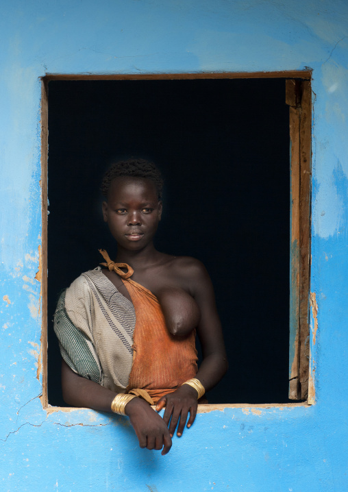 Bodi Woman Posing In Frame Of A Window Blue House Hana Mursi Village Omo Valley Ethiopia