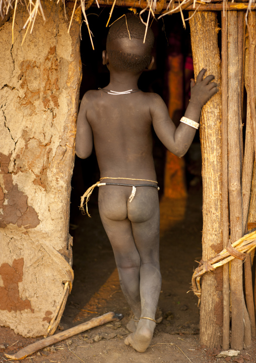 Naked Little Baby Bodi Boy Entering A Clay Hut Omo Valley Ethiopia