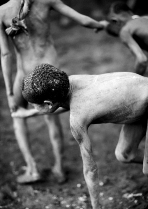 Young Bodi Boy Crouching At Kael New Year Ceremony Omo Valley Ethiopia