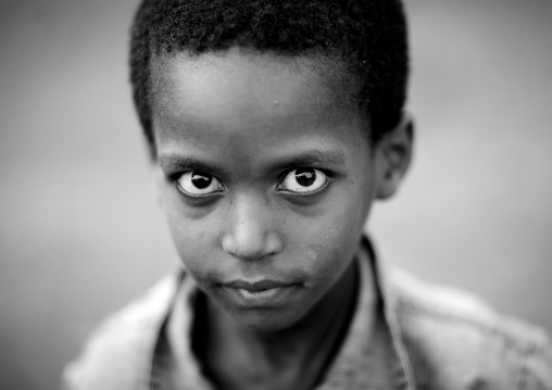 Tough interrogative look of young boy Ethiopia