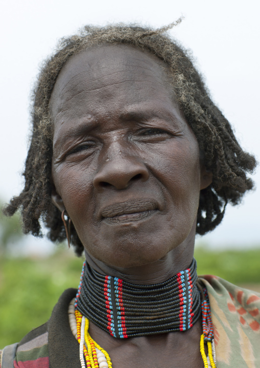 Senior woman portrait with beaded necklace  omo valley Ethiopia