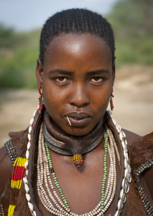Portrait Of Beautiful Dark Eyed Hamer Woman Wearing Beaded Necklace  Omo Valley Ethiopia