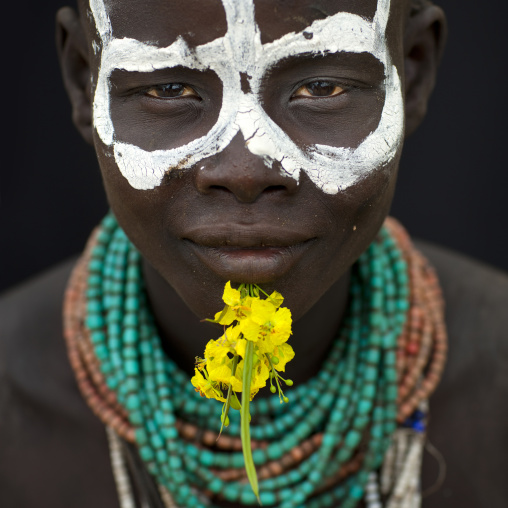 Portrait Of Karo Woman With Painted Face And Flower Ethiopia