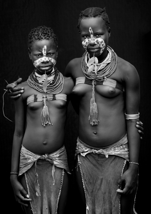Couple Of Painted Faces Standing Karo Teenage Girls With Beaded Bras Holding Each Other Omo Valley Ethiopia