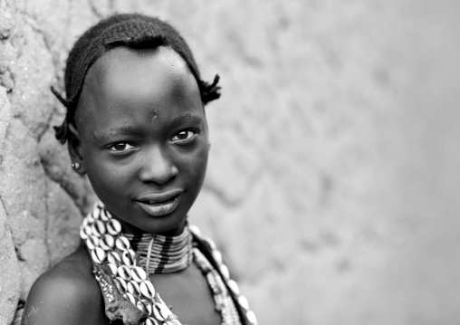Portrait Of Hamer Beautiful Girl Posing In Front Of Clay House  Omo Valley Ethiopia