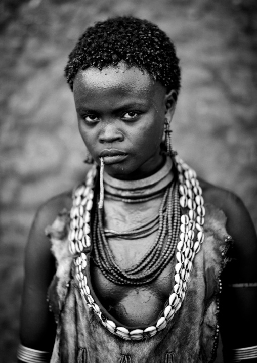 Portrait Of Hamer Beautiful Woman Posing In Front Of Clay House  Omo Valley Ethiopia