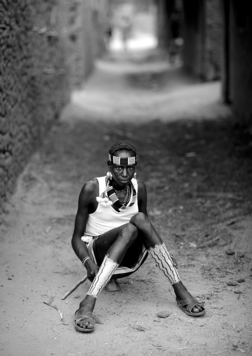 Teenage Boy Sitting In A Street Of Turmi Village Omo Valley Ethiopia
