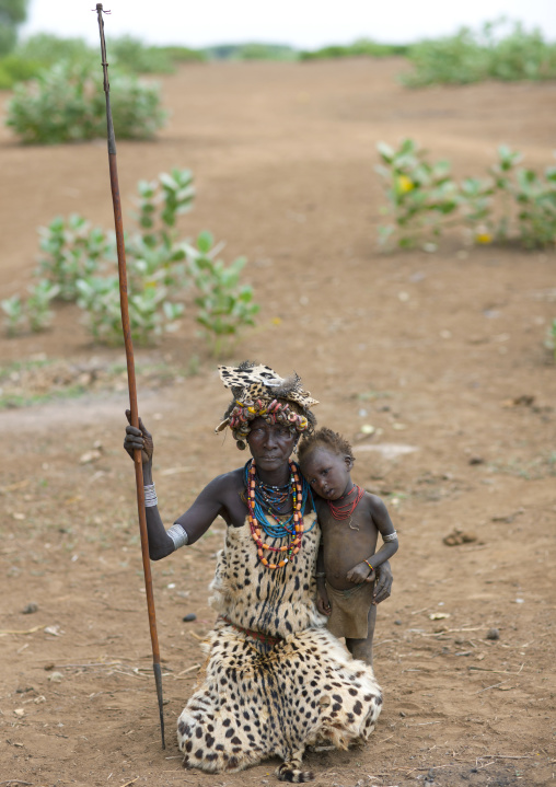 Senior Dassanech Woman Wearing Cheetah Skin And Baby Boy Omo Valley Ethiopia