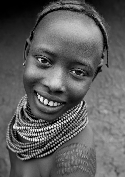 Young Dassanech Girl With Scarified Shoulder And Beaded Necklaces Smile Portrait Omorate Ethiopia