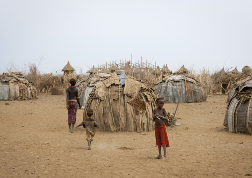 Kids In The Middle Of Iron And Natural Materials Huts Dassanech Village Omorate Ethiopia