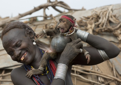 Dassanech Woman Playing With Little Monkey Pet Omo Valley Ethiopia