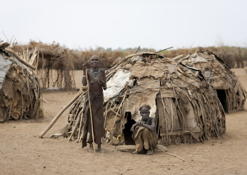 Couple Of Senior Dassanech People Standing In Front Of Their Huts Omo Valley Ethiopia