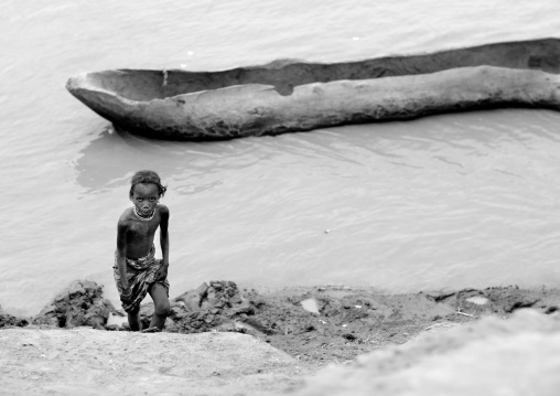 Young Dassanech Girl Near To A Pirogue On The River Omo Valley Ethiopia