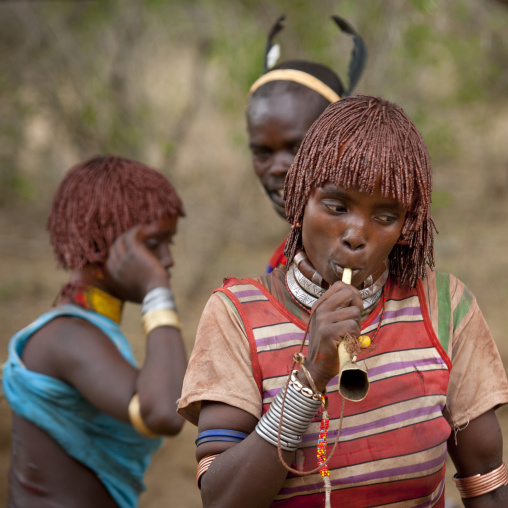 Hamer Woman With Ochred Hair Blowing A Horn Omo Valley Ethiopia