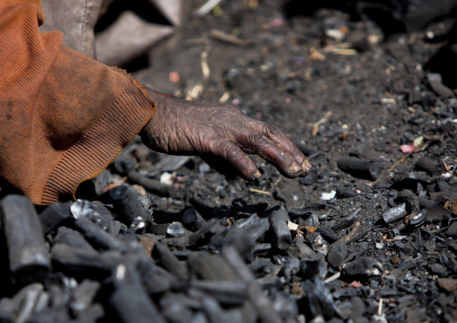 Hand of a woman in coal, Adama, Ethiopia